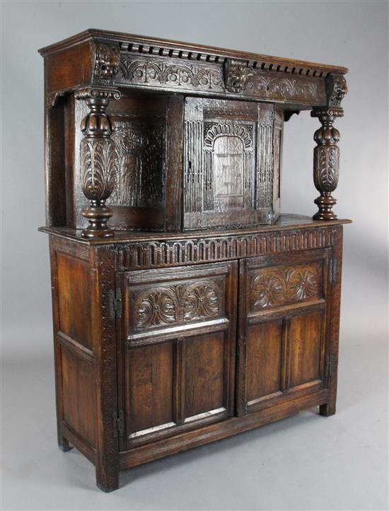 A 17th century style oak court cupboard, W.4ft 3in. D.1ft 7in. H.5ft 3in.